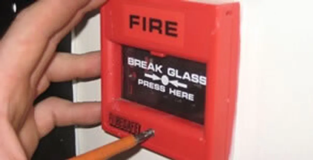 fire alarm installation service showing manual fire alarm pull station installed by licensed electricians in Bellevue, NE