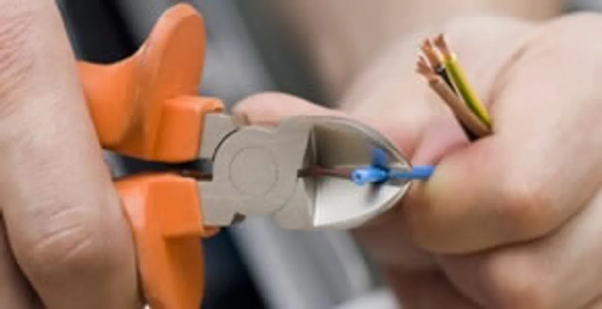professional electrical services showing precise wire cutting by licensed electricians in Bellevue, NE