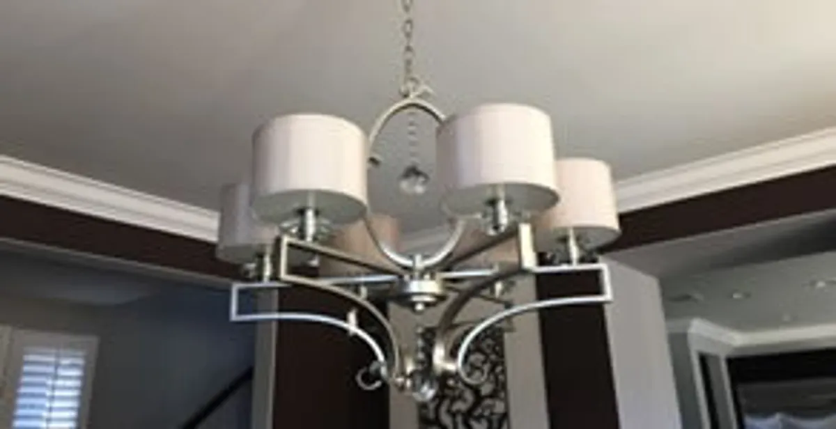 Modern chandelier installation with multiple light fixtures in Bellevue, NE