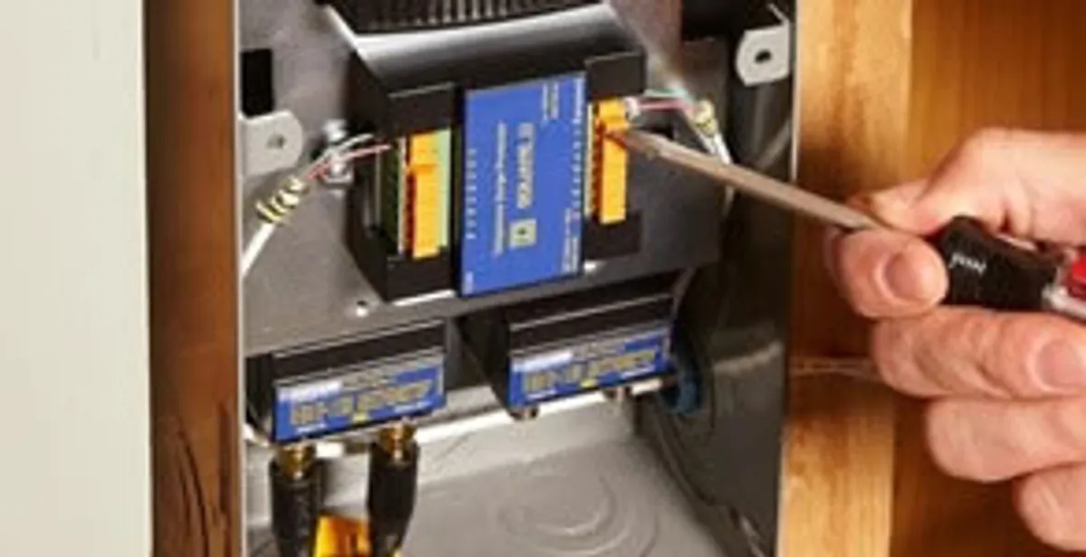Whole home surge protection device being installed by a licensed electrician to protect electrical systems in Bellevue, NE